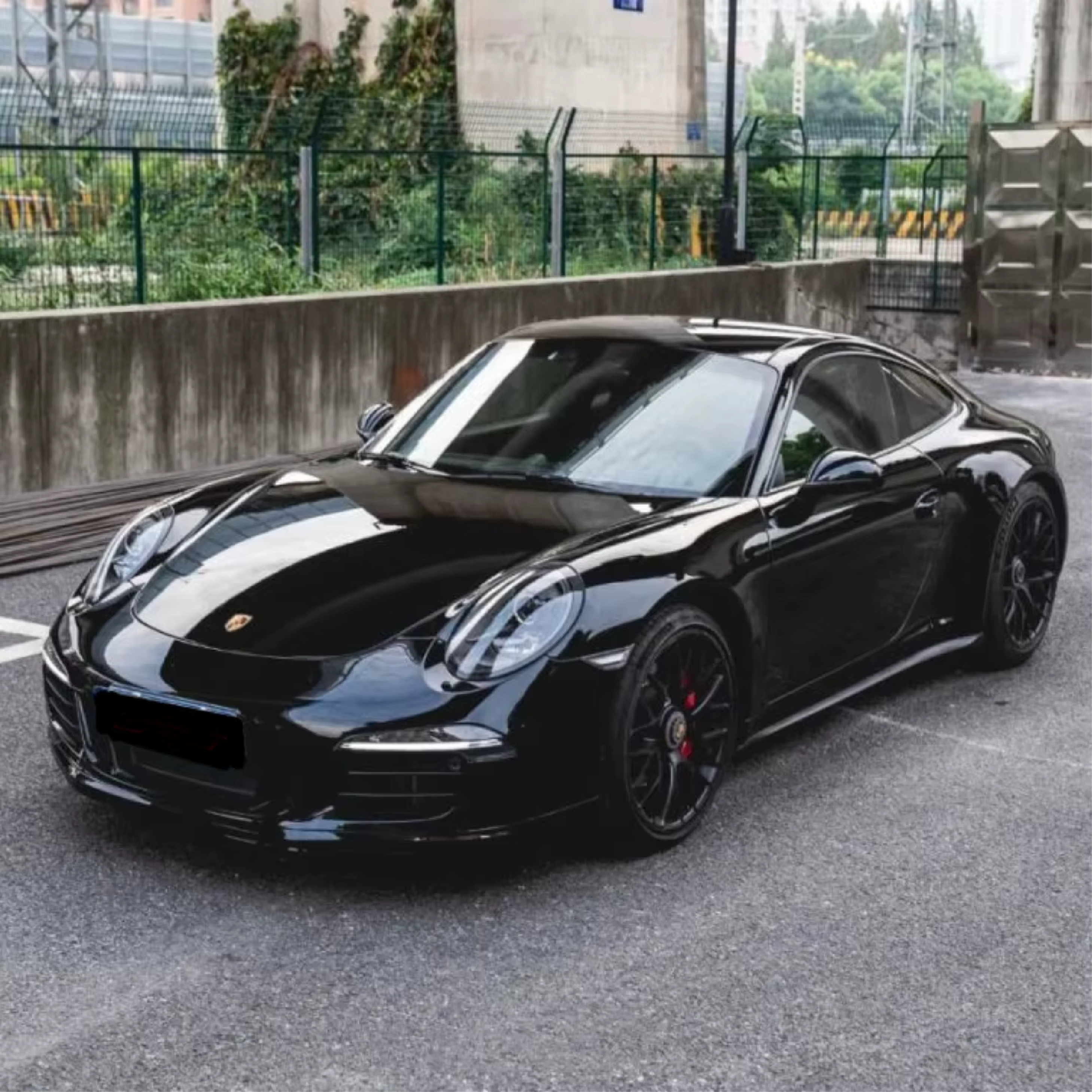 Gloss Black Metallic Vinyl Car Wrap applied to vehicle, showcasing deep black color with metallic flake and a smooth high-gloss reflective finish