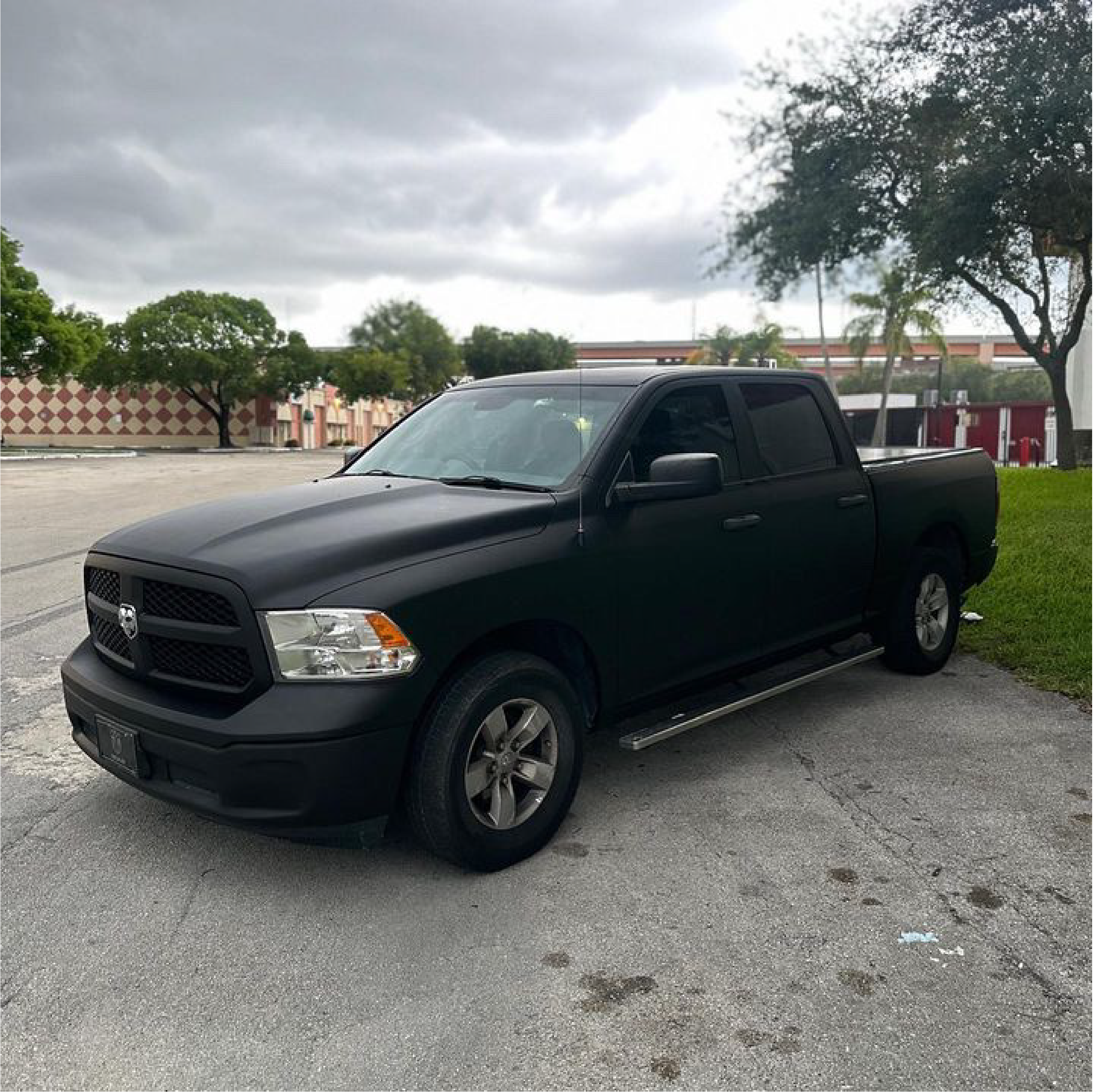 Matte Black Vinyl Car Wrap applied to vehicle, showcasing smooth non-reflective finish and deep black color for a sleek, stealth appearance