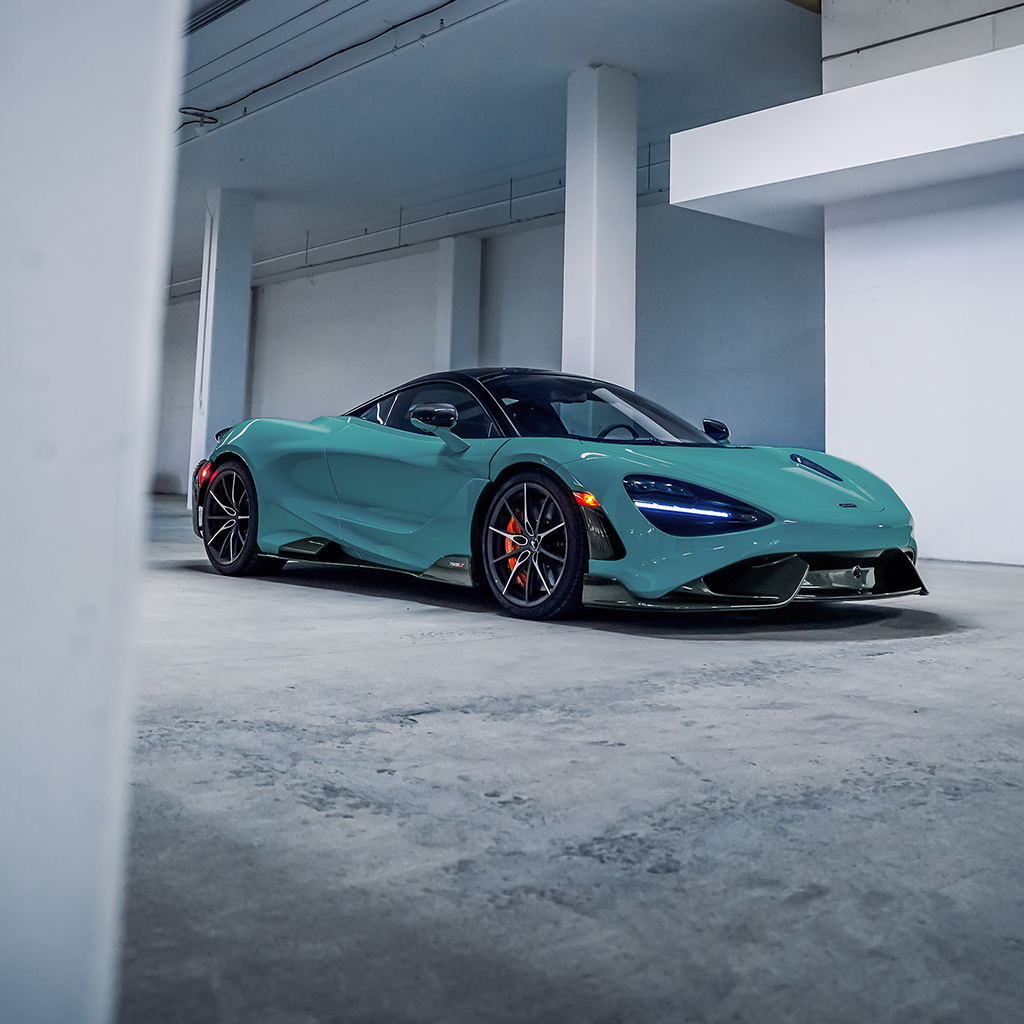 Turquoise sports car in a modern, minimalistic setting