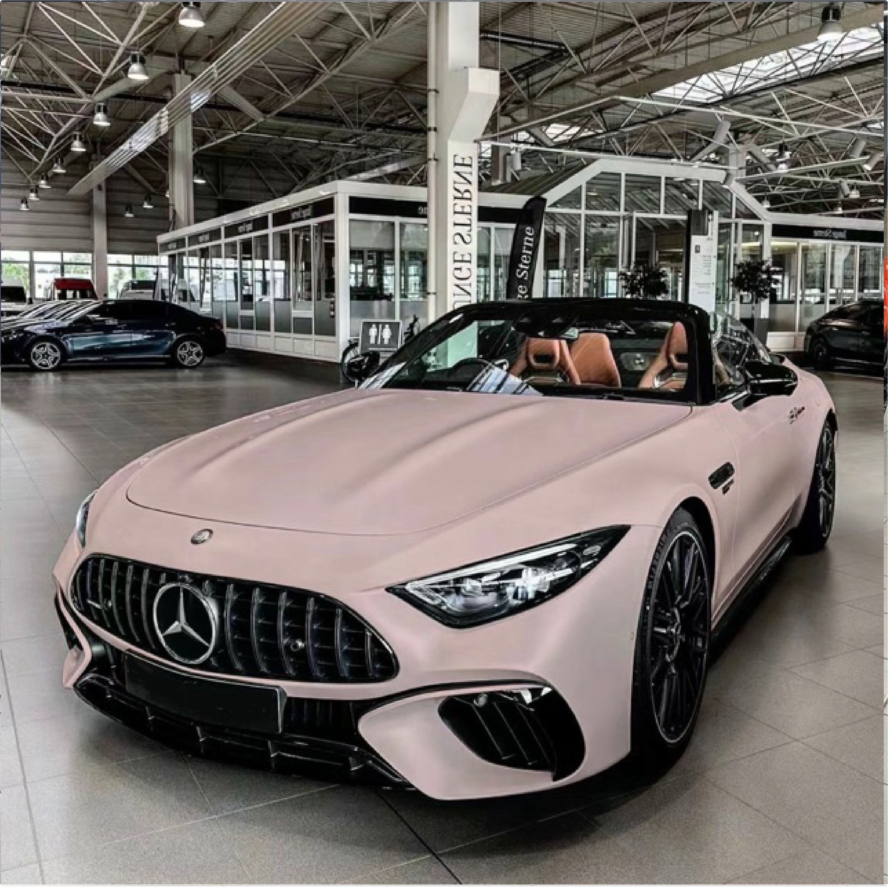 perfect peach Mercedes-Benz convertible in a showroom