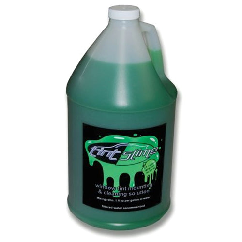 A green gallon-sized container of TINT SLIME, which is a window tint mounting & cleaning solution.