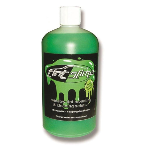 A bottle of TINT SLIME window tint mounting & cleaning solution.