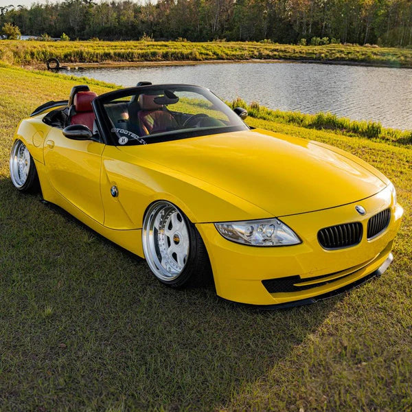 Gloss Bright Yellow Vinyl Car Wrap applied to vehicle, showcasing bold yellow color with a smooth high-gloss finish and reflective surface