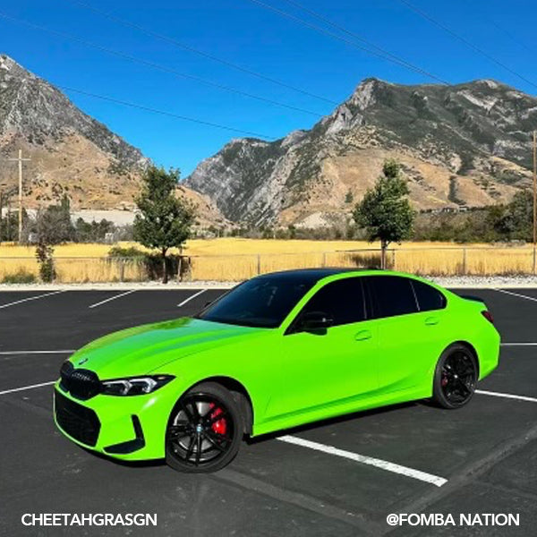 Gloss Grass Green Vinyl Car Wrap applied to vehicle, featuring vibrant green color with a smooth high-gloss finish and reflective surface