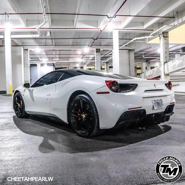 Gloss Pearl White Vinyl Car Wrap with smooth, high-gloss finish and subtle pearlescent shimmer, shown partially unrolled for vehicle wrap application.