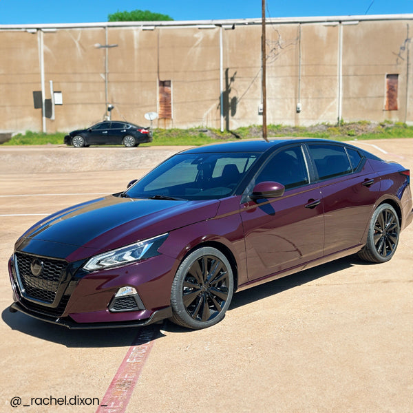 Gloss Black Rose Vinyl Car Wrap applied to vehicle, showcasing deep black color with subtle rose undertones and a sleek high-gloss reflective finish