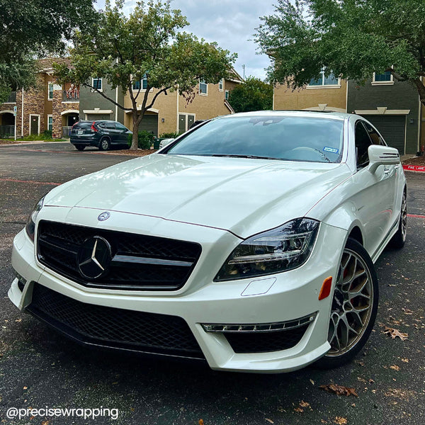 Gloss Pearl White Vinyl Car Wrap with smooth, high-gloss finish and subtle pearlescent shimmer, shown partially unrolled for vehicle wrap application.