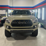 Gloss Khaki Green Vinyl Car Wrap with rich green tone and reflective finish, shown partially unrolled for vehicle wrapping application.  
