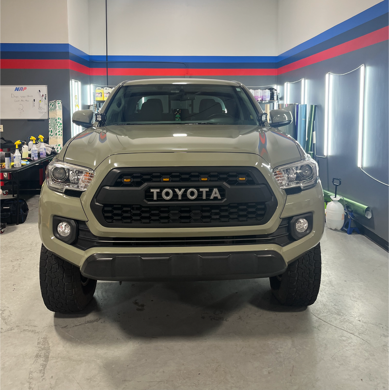 Gloss Khaki Green Vinyl Car Wrap with rich green tone and reflective finish, shown partially unrolled for vehicle wrapping application.  
