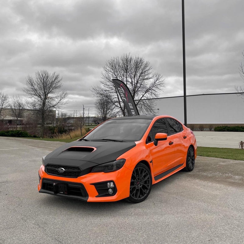 Gloss Orange Vinyl Car Wrap applied to vehicle, showcasing vibrant orange color with a smooth high-gloss finish and reflective surface