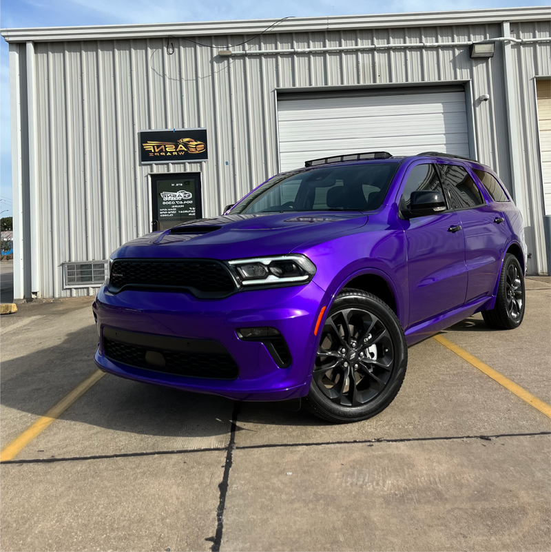 Gloss Passion Purple Vinyl Car Wrap applied to vehicle, highlighting vibrant purple color with a smooth high-gloss finish and reflective surface