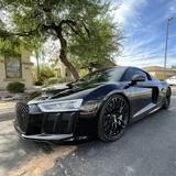 Gloss Black Vinyl Car Wrap applied to vehicle, showcasing deep black color with a smooth high-gloss finish and mirror-like reflective surface