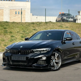 Gloss Black Vinyl Car Wrap applied to vehicle, showcasing deep black color with a smooth high-gloss finish and mirror-like reflective surface