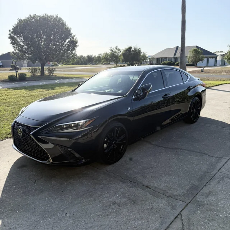 Gloss Black Vinyl Car Wrap applied to vehicle, showcasing deep black color with a smooth high-gloss finish and mirror-like reflective surface