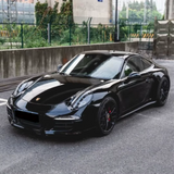Gloss Black Metallic Vinyl Car Wrap applied to vehicle, showcasing deep black color with metallic flake and a smooth high-gloss reflective finish
