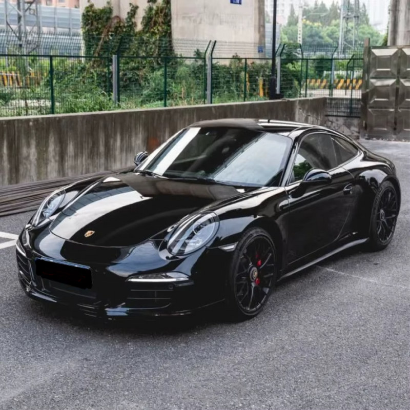 Gloss Black Metallic Vinyl Car Wrap applied to vehicle, showcasing deep black color with metallic flake and a smooth high-gloss reflective finish
