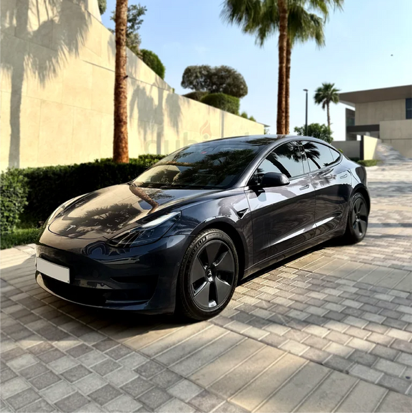 Gloss Black Metallic Vinyl Car Wrap applied to vehicle, showcasing deep black color with metallic flake and a smooth high-gloss reflective finish
