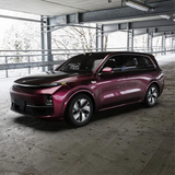 Gloss Black Rose Vinyl Car Wrap applied to vehicle, showcasing deep black color with subtle rose undertones and a sleek high-gloss reflective finish