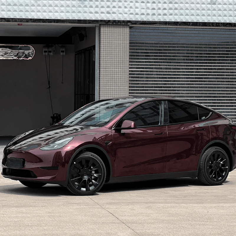 Gloss Black Rose Vinyl Car Wrap applied to vehicle, showcasing deep black color with subtle rose undertones and a sleek high-gloss reflective finish