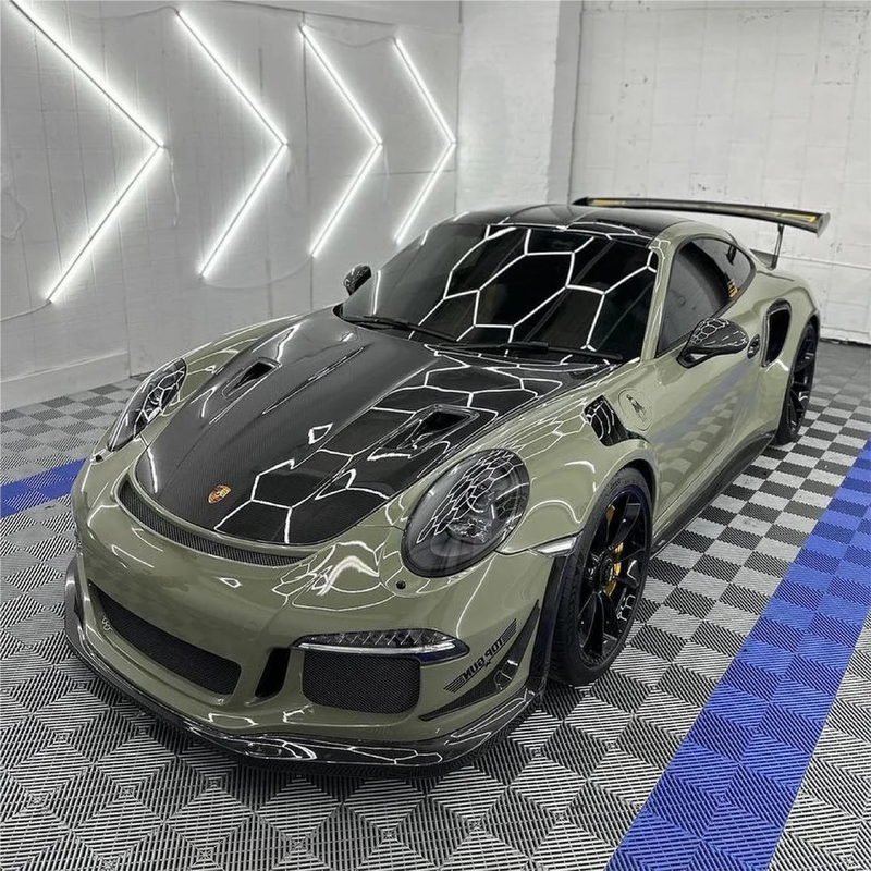 Gloss Khaki Green Vinyl Car Wrap with rich green tone and reflective finish, shown partially unrolled for vehicle wrapping application.  
