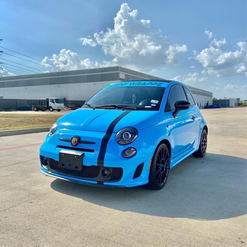 Gloss Light Blue Vinyl Car Wrap applied to vehicle, showcasing soft sky-blue color with a smooth high-gloss finish and reflective surface