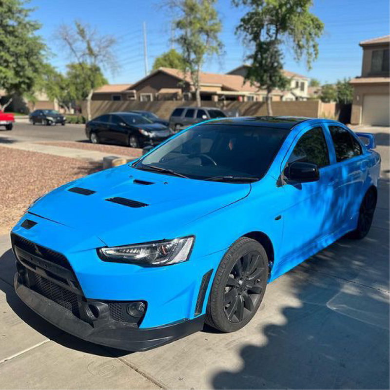 Gloss Light Blue Vinyl Car Wrap applied to vehicle, showcasing soft sky-blue color with a smooth high-gloss finish and reflective surface