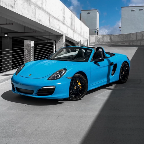 Gloss Light Blue Vinyl Car Wrap applied to vehicle, showcasing soft sky-blue color with a smooth high-gloss finish and reflective surface