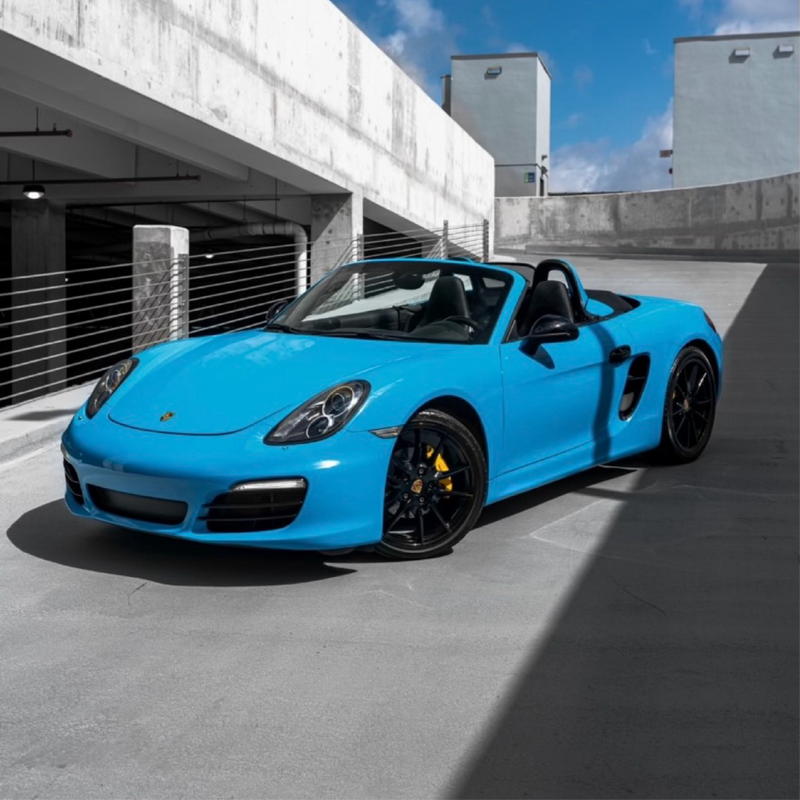 Gloss Light Blue Vinyl Car Wrap applied to vehicle, showcasing soft sky-blue color with a smooth high-gloss finish and reflective surface