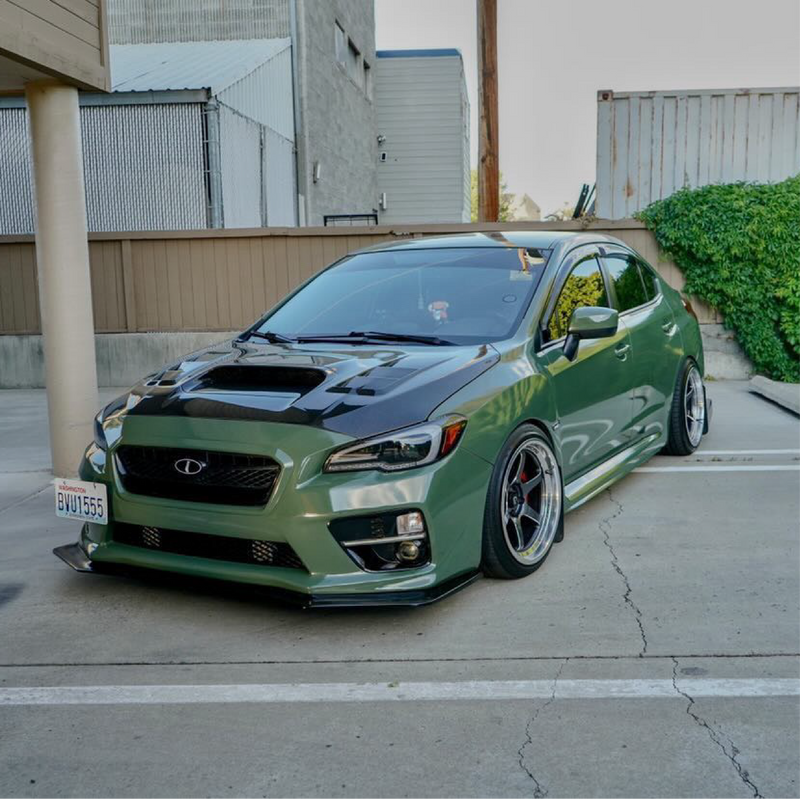 Gloss Military Green Vinyl Car Wrap applied to vehicle, showcasing rich army green color with a smooth, high-gloss finish and reflective surface