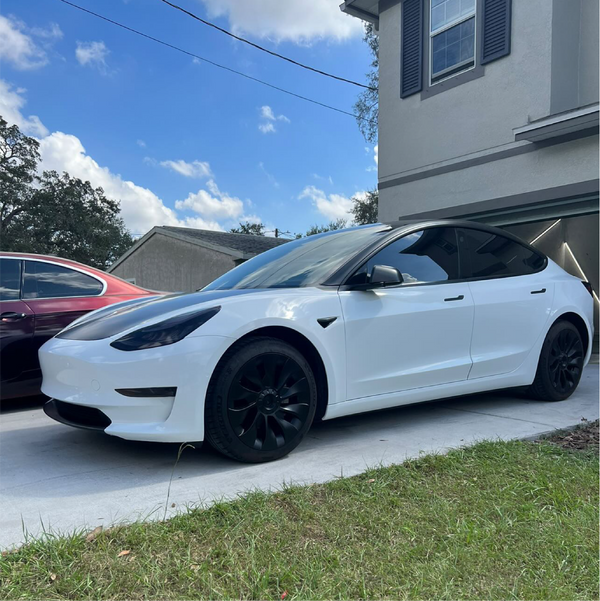 Gloss White Vinyl Car Wrap applied to vehicle, showcasing clean white color with a smooth high-gloss finish and reflective surface