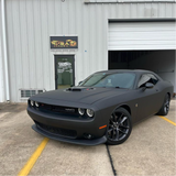 Matte Black Vinyl Car Wrap applied to vehicle, showcasing smooth non-reflective finish and deep black color for a sleek, stealth appearance