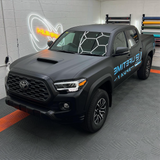 Matte Black Vinyl Car Wrap applied to vehicle, showcasing smooth non-reflective finish and deep black color for a sleek, stealth appearance