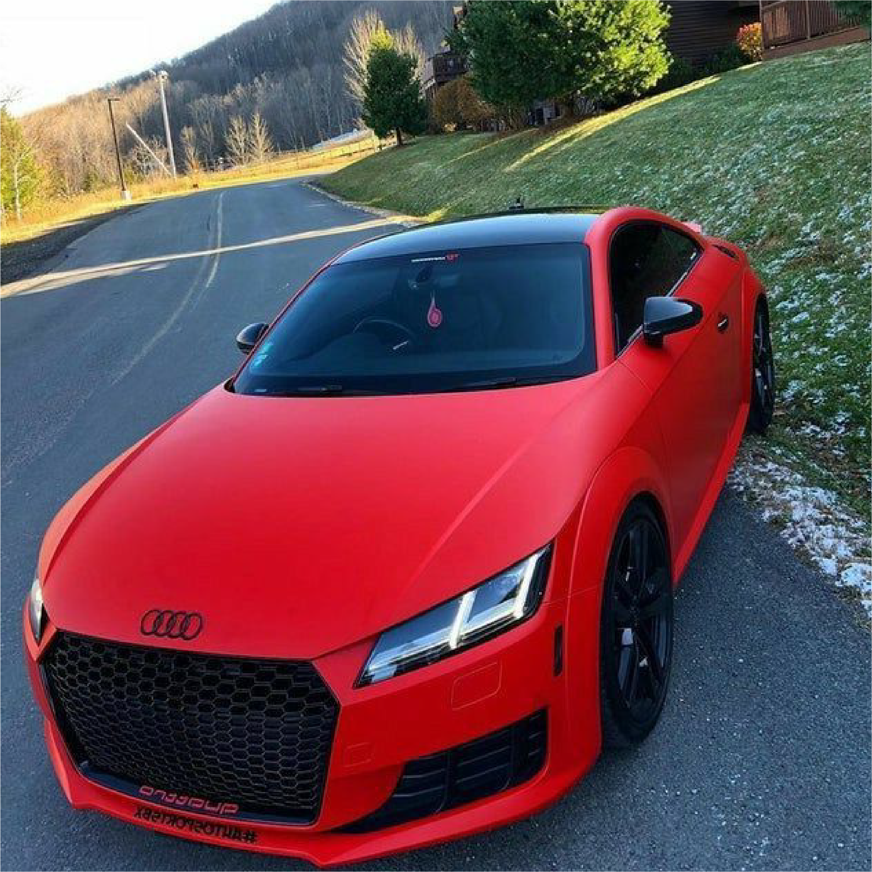 Matte Carmine Red Vinyl Car Wrap applied to vehicle, showcasing deep red color with smooth matte finish and bold, non-reflective appearance