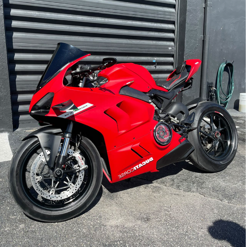 Matte Carmine Red Vinyl Car Wrap applied to vehicle, showcasing deep red color with smooth matte finish and bold, non-reflective appearance