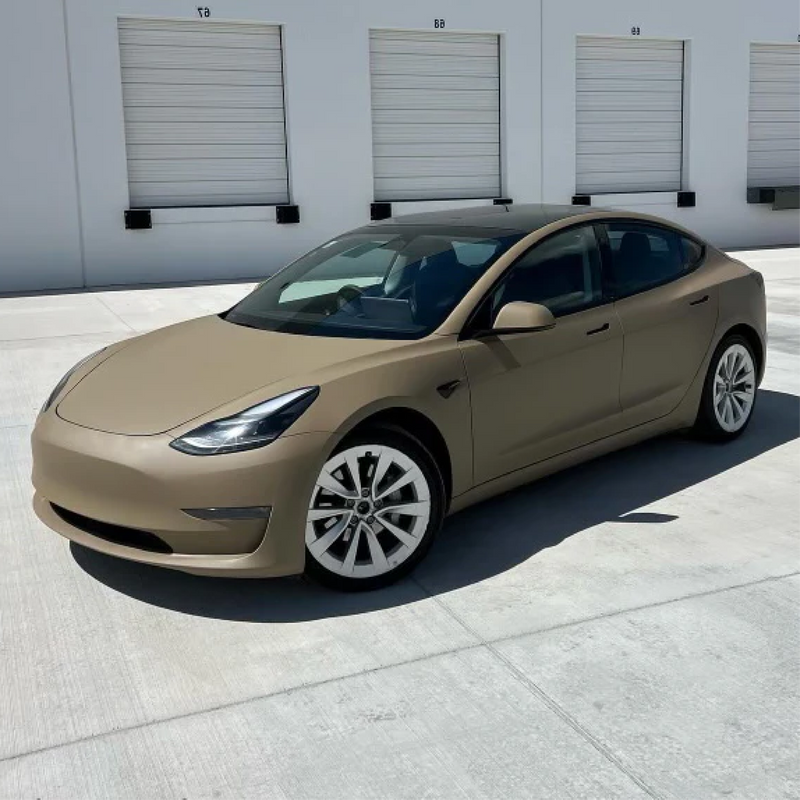 Matte Desert Tan Vinyl Car Wrap with smooth, non-glossy finish in tactical beige, shown rolled and partially unrolled for vehicle application.  