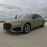 Matte Khaki Green Vinyl Car Wrap with non-reflective military green finish, shown partially unrolled for vehicle wrap application.  
