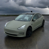 Matte Khaki Green Vinyl Car Wrap with non-reflective military green finish, shown partially unrolled for vehicle wrap application.  
