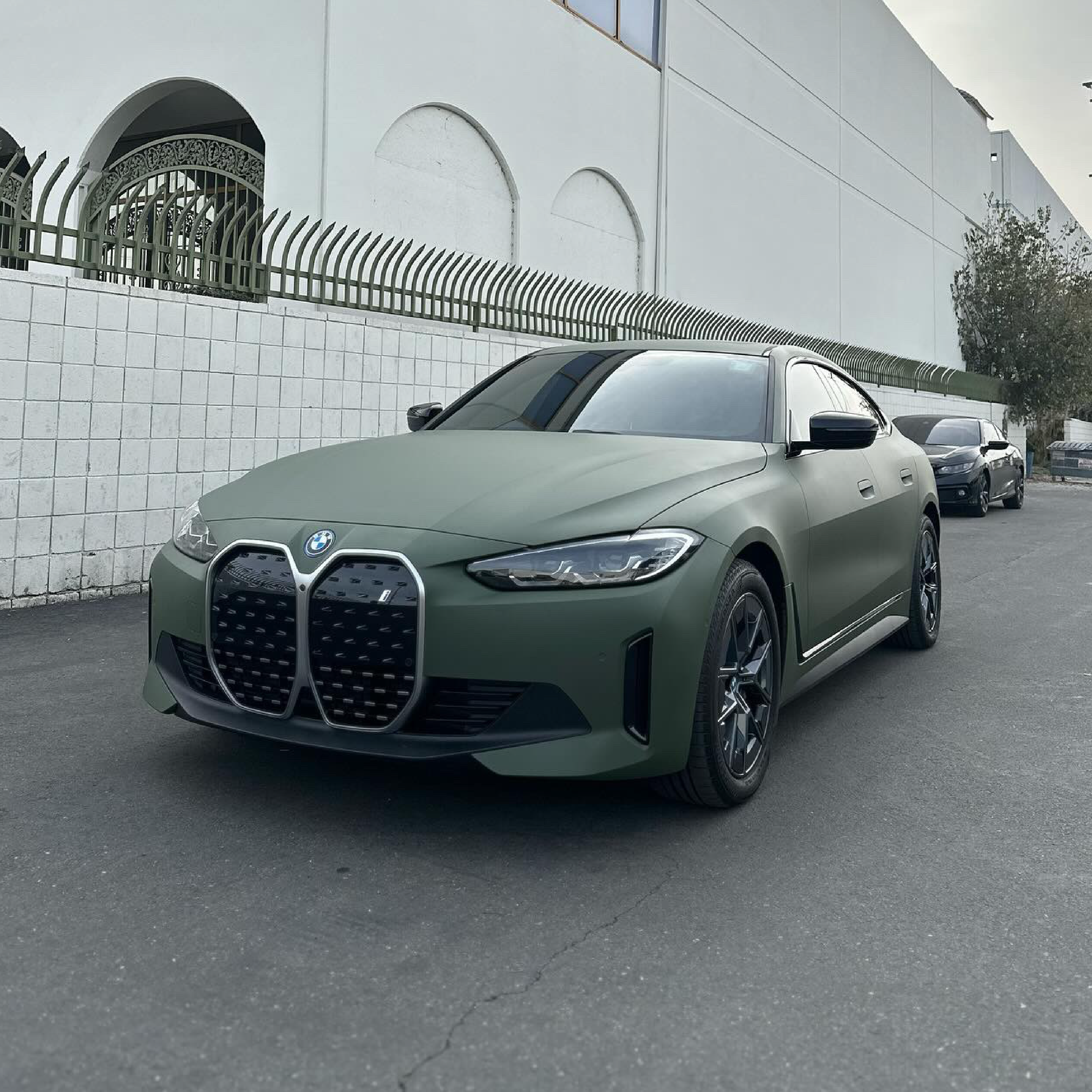 Matte Military Green Vinyl Car Wrap applied to vehicle, featuring a deep tactical green color with smooth matte finish and rugged, non-reflective appearance