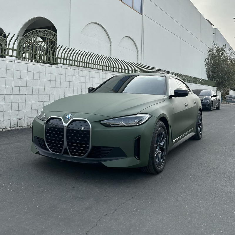 Matte Military Green Vinyl Car Wrap applied to vehicle, featuring a deep tactical green color with smooth matte finish and rugged, non-reflective appearance