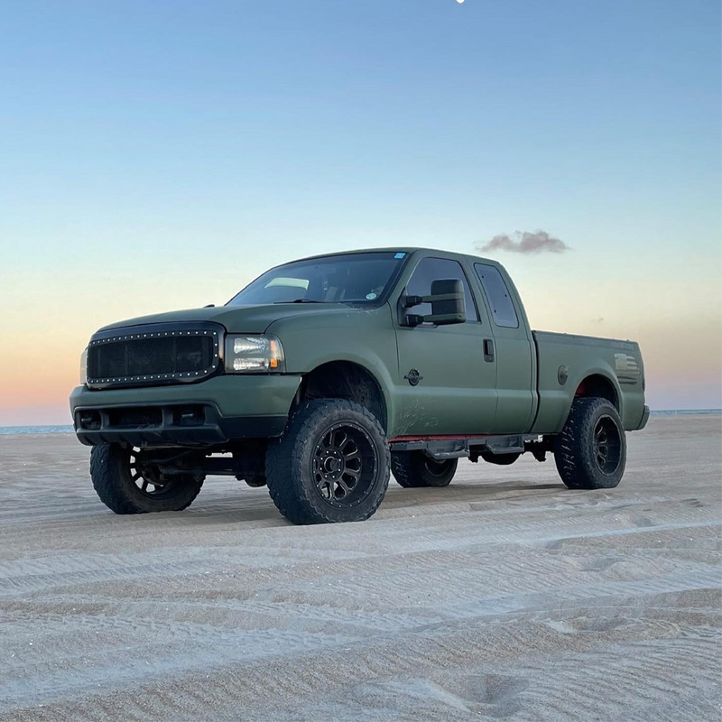 Matte Military Green Vinyl Car Wrap applied to vehicle, featuring a deep tactical green color with smooth matte finish and rugged, non-reflective appearance