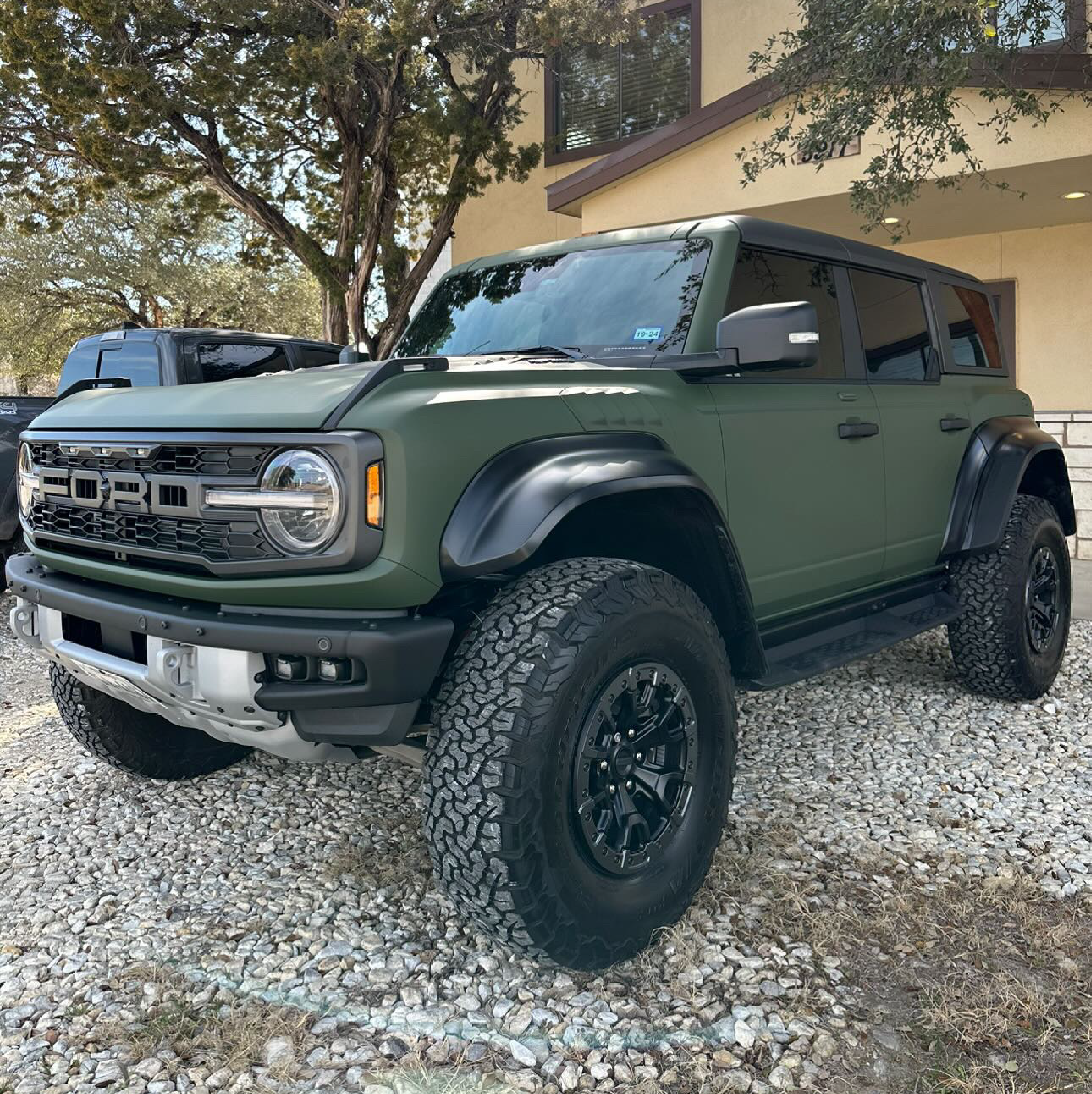 Matte Military Green Vinyl Car Wrap applied to vehicle, featuring a deep tactical green color with smooth matte finish and rugged, non-reflective appearance