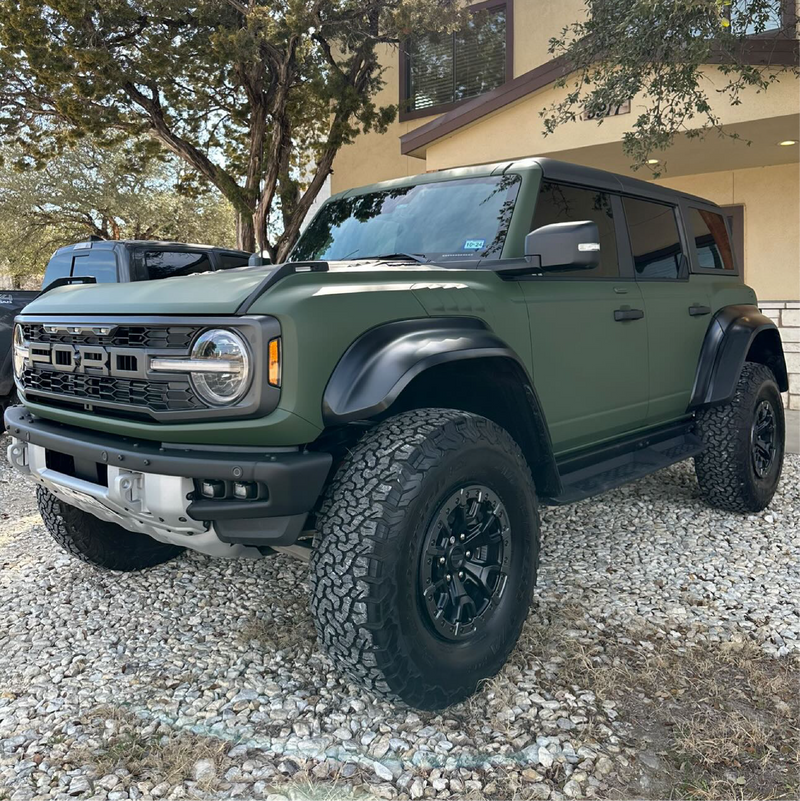 Matte Military Green Vinyl Car Wrap applied to vehicle, featuring a deep tactical green color with smooth matte finish and rugged, non-reflective appearance