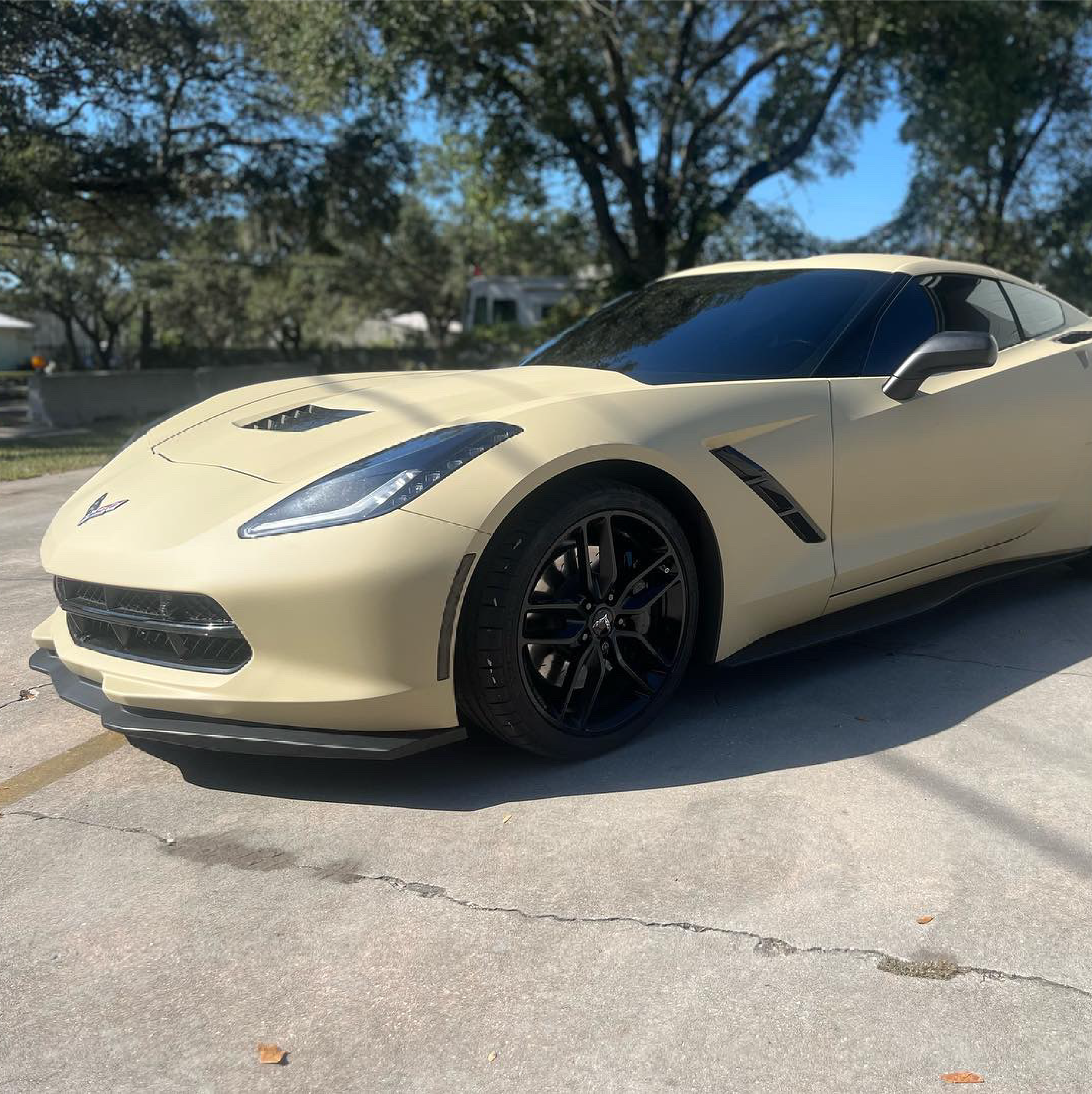 Matte Sandstorm Vinyl Car Wrap in a smooth beige finish, shown partially unrolled with soft, non-reflective texture for vehicle wrapping.  