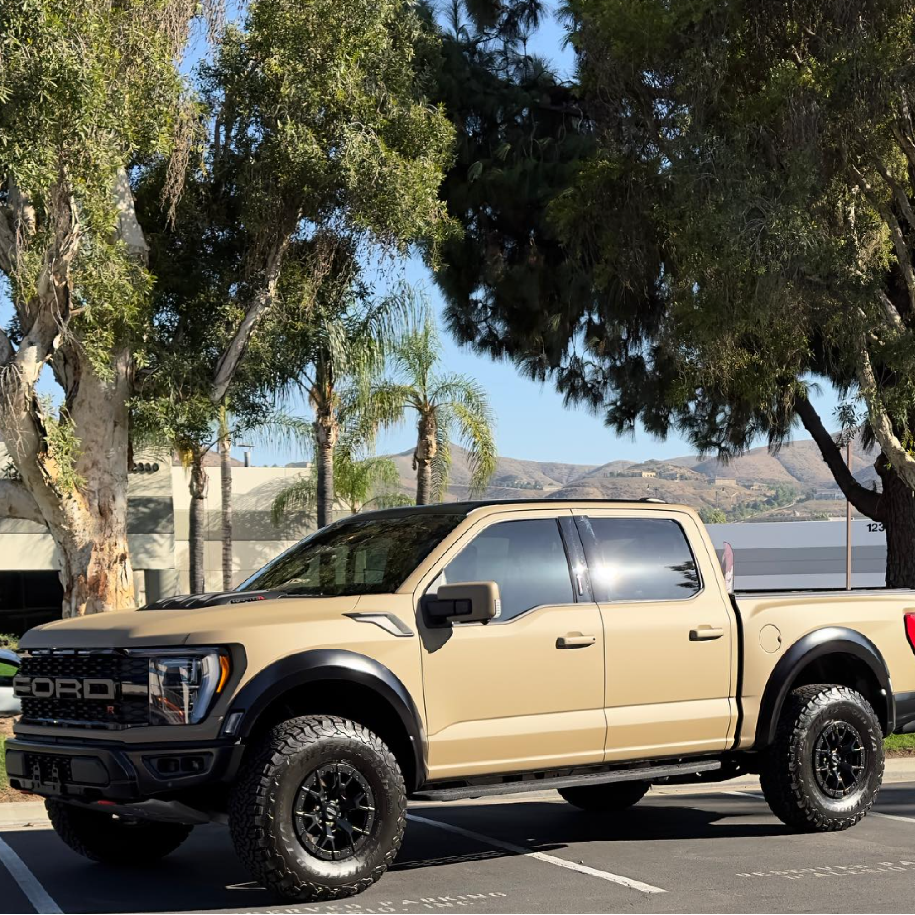 Matte Sandstorm Vinyl Car Wrap in a smooth beige finish, shown partially unrolled with soft, non-reflective texture for vehicle wrapping.  