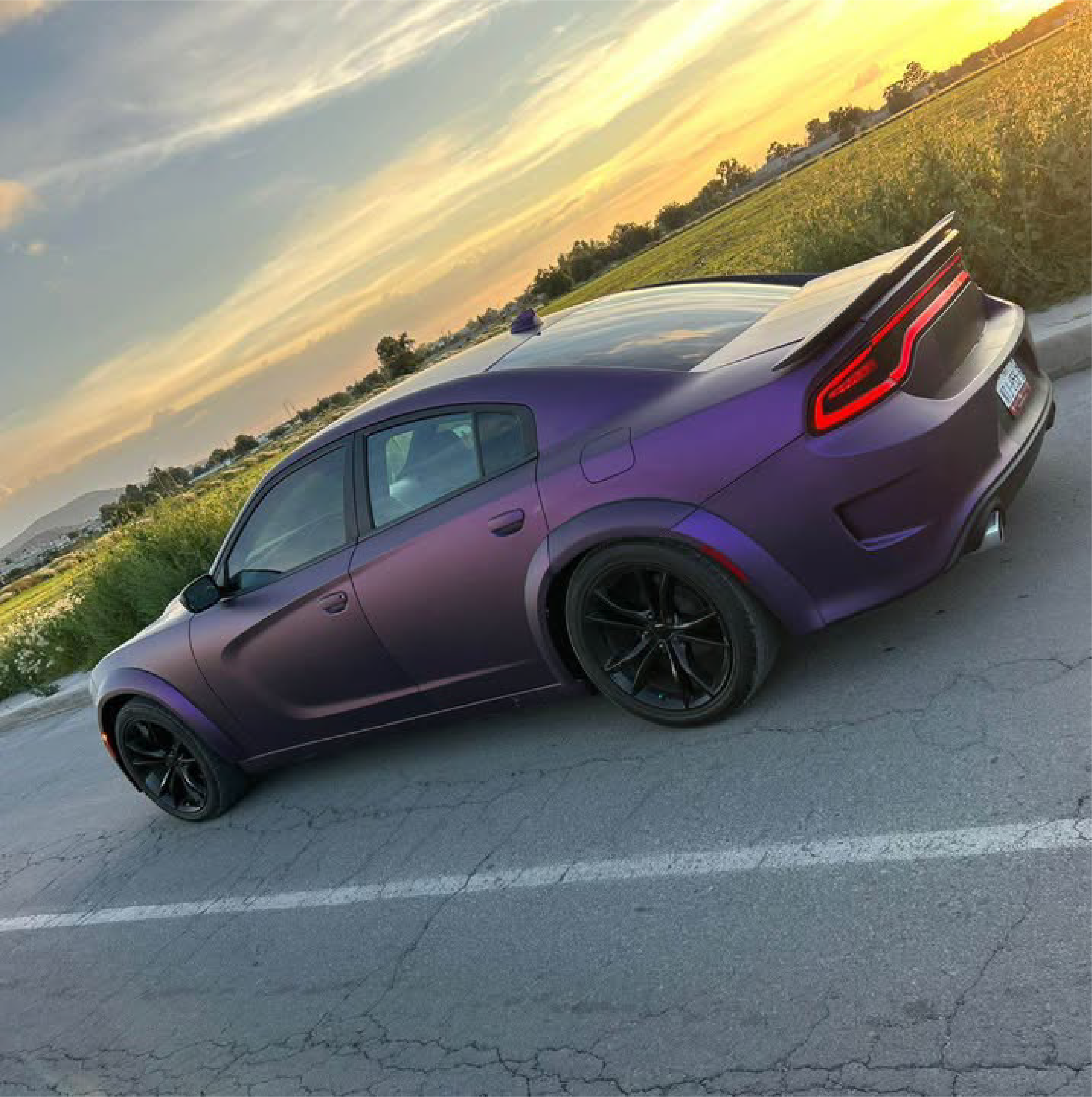 Satin Black Rose Aluminum Vinyl Car Wrap applied to vehicle, showing deep black color with subtle rose undertones and a smooth satin aluminum finish