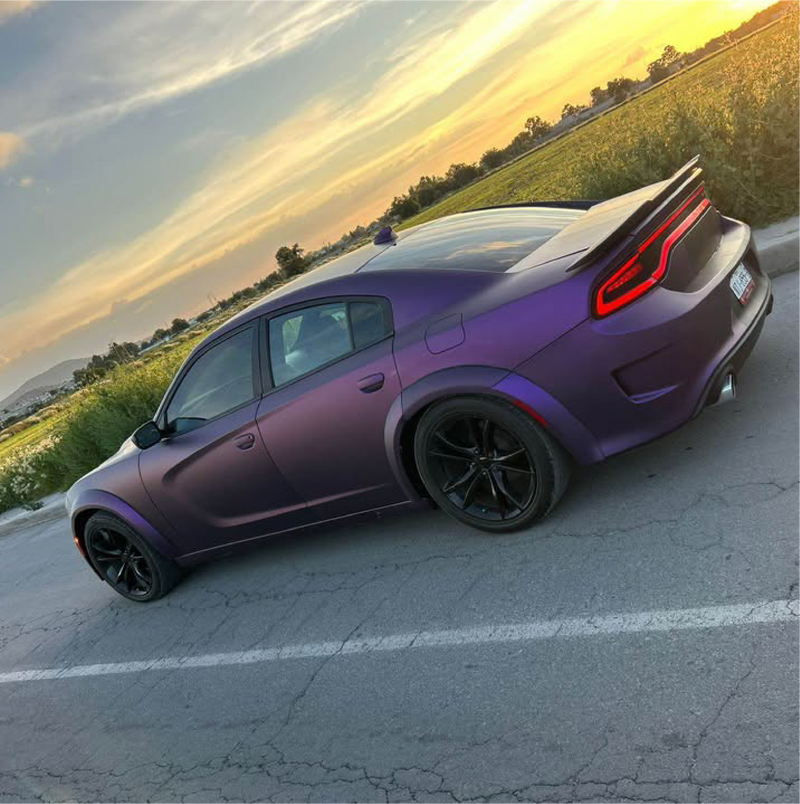 Satin Black Rose Aluminum Vinyl Car Wrap applied to vehicle, showing deep black color with subtle rose undertones and a smooth satin aluminum finish