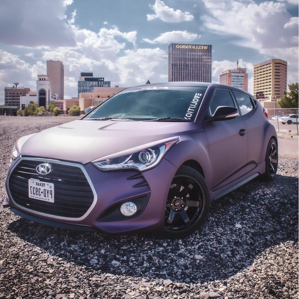 Satin Black Rose Aluminum Vinyl Car Wrap applied to vehicle, showing deep black color with subtle rose undertones and a smooth satin aluminum finish