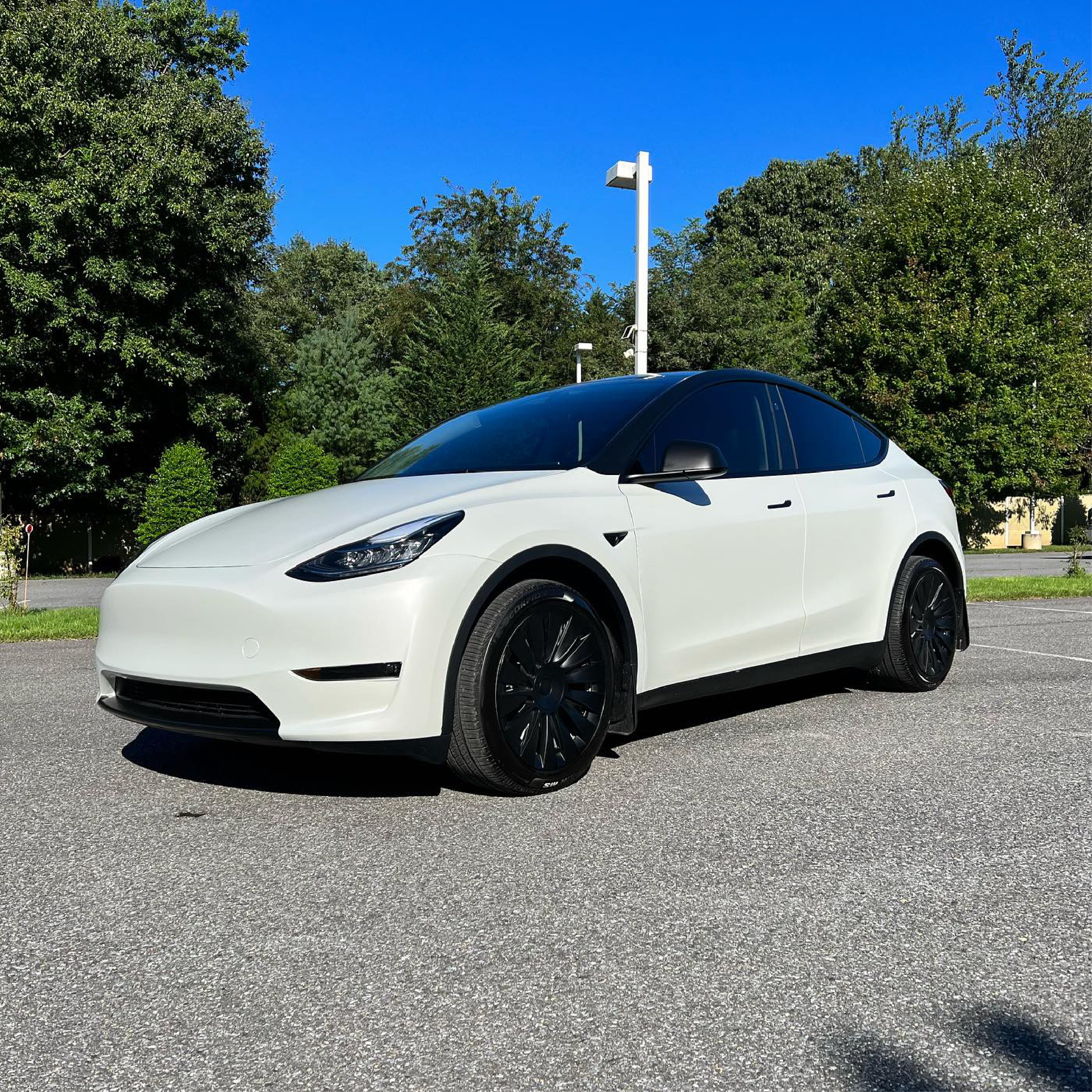 Satin Pearl White Vinyl Car Wrap applied to vehicle, showcasing smooth satin finish with subtle pearlescent shimmer and clean white tone