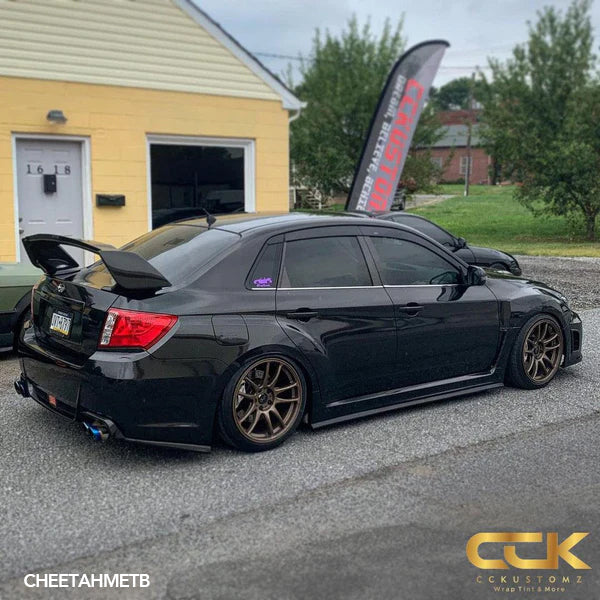 Gloss Black Metallic Vinyl Car Wrap applied to vehicle, showcasing deep black color with metallic flake and a smooth high-gloss reflective finish