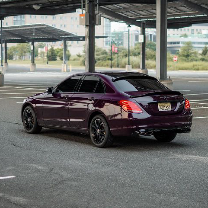 Mercedes-Benz car parked on a street with a cityscape background